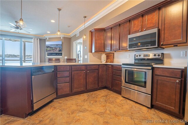 kitchen with a ceiling fan, crown molding, light countertops, a peninsula, and appliances with stainless steel finishes
