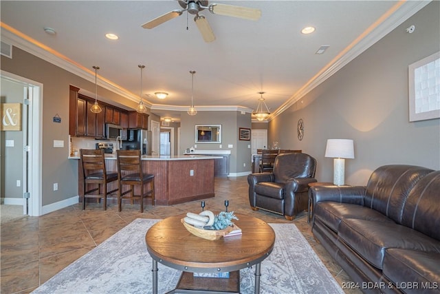 tiled living room featuring ceiling fan, baseboards, and crown molding