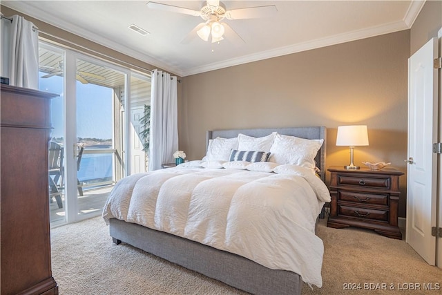 bedroom featuring access to exterior, light colored carpet, and ornamental molding