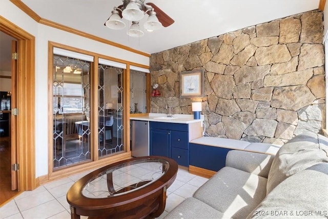 bathroom featuring tile patterned flooring, vanity, and ornamental molding