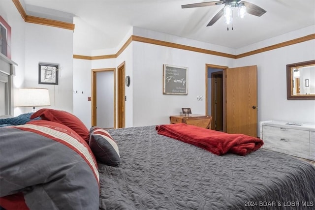 bedroom with ceiling fan and crown molding