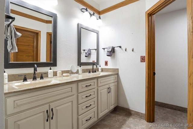 bathroom with vanity and ornamental molding