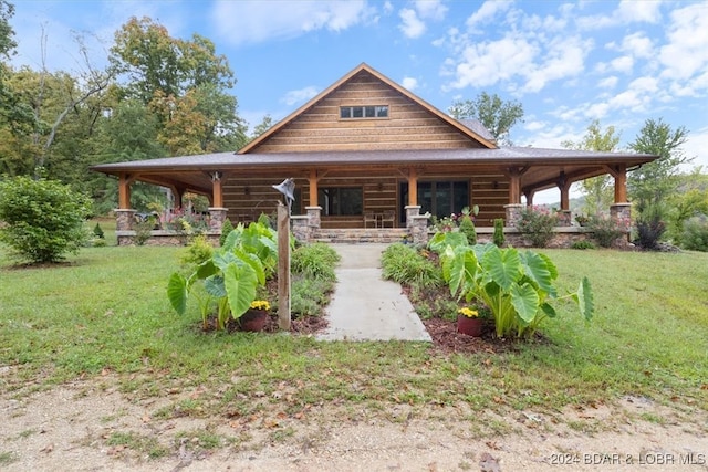 log home with a front lawn and covered porch