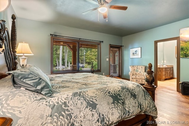 bedroom featuring light hardwood / wood-style flooring, connected bathroom, and ceiling fan