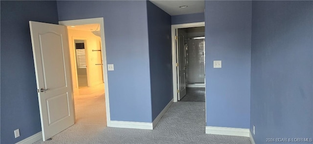 hallway with carpet