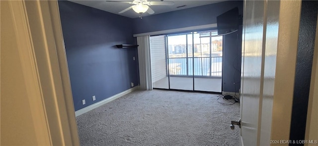 carpeted empty room with ceiling fan