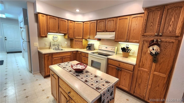 kitchen with sink and white appliances