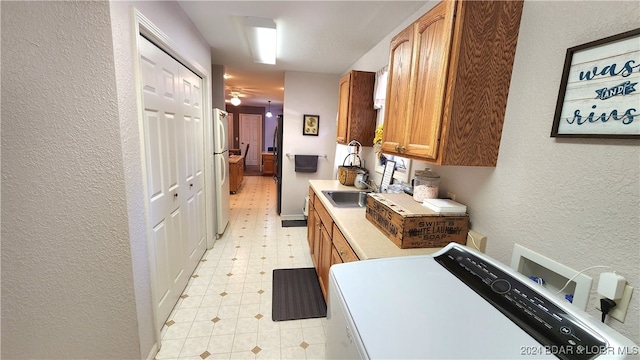 kitchen with white fridge and sink