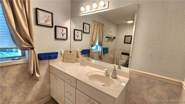 bathroom with vanity and toilet