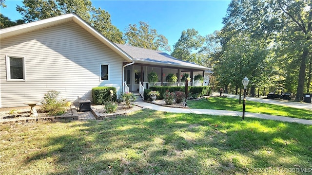 exterior space featuring a yard and covered porch