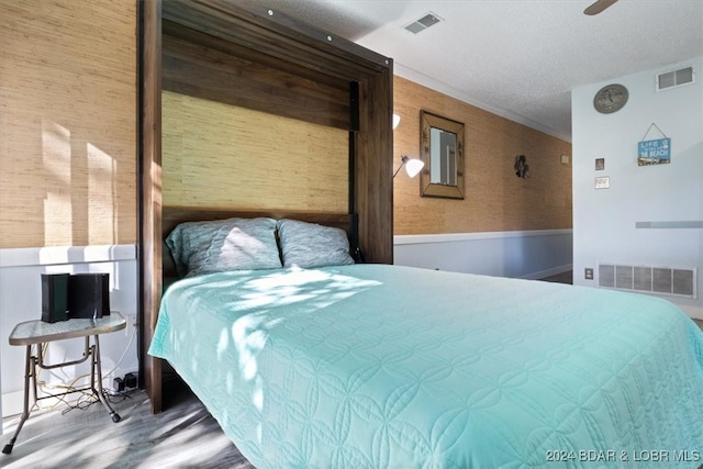 bedroom with ceiling fan and hardwood / wood-style floors