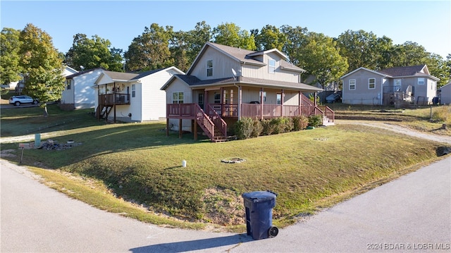 view of front of house with a front lawn and a deck