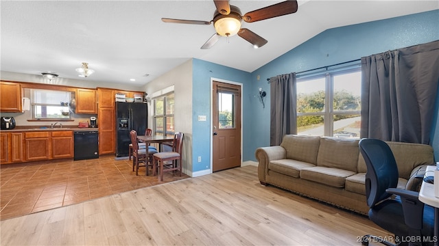 office area featuring lofted ceiling, ceiling fan, sink, and light hardwood / wood-style floors