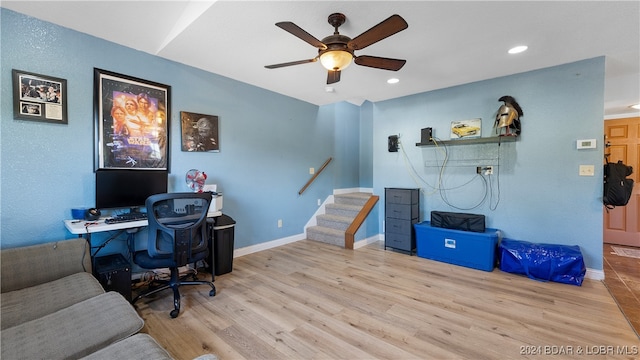 office space with light hardwood / wood-style flooring and ceiling fan