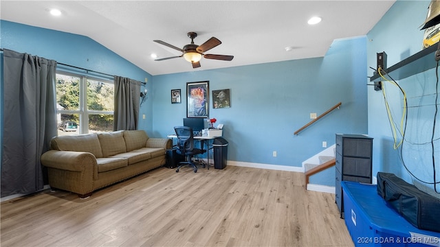 interior space featuring light hardwood / wood-style floors, vaulted ceiling, and ceiling fan