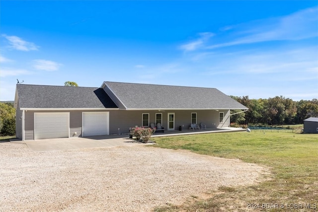 single story home with a front yard, a garage, and a porch