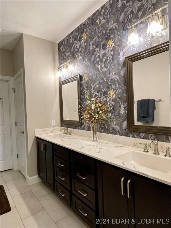 bathroom with tile patterned flooring and vanity