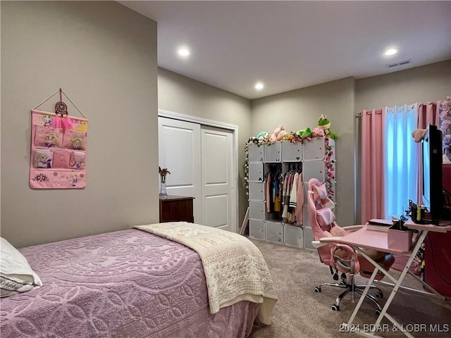 carpeted bedroom with a closet