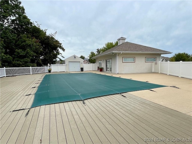 view of swimming pool with an outdoor structure