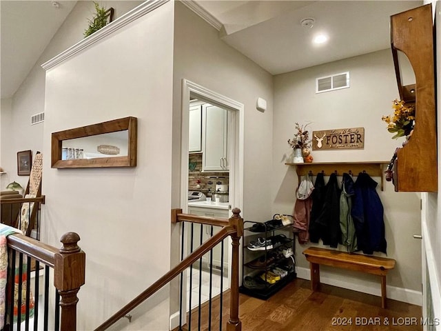 corridor with dark hardwood / wood-style flooring