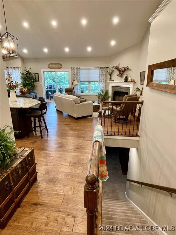 living room featuring a chandelier and hardwood / wood-style floors