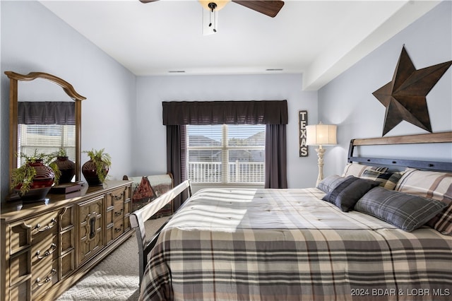 carpeted bedroom featuring ceiling fan