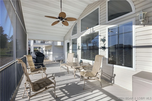 exterior space featuring ceiling fan and lofted ceiling