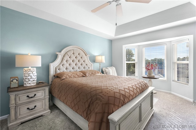 bedroom featuring light colored carpet and ceiling fan