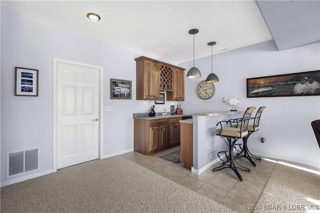 959 High St, Osage Beach, MO 65065 - bar featuring light tile patterned floors, visible vents, baseboards, indoor wet bar, and decorative light fixtures