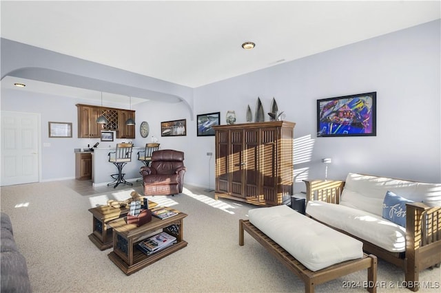 959 High St, Osage Beach, MO 65065 - living area with light colored carpet, indoor bar, and arched walkways