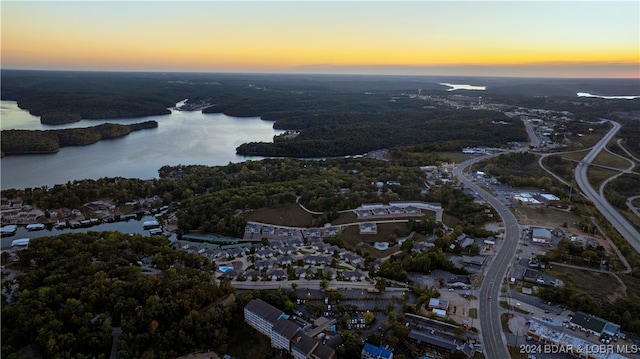 aerial view at dusk with a water view