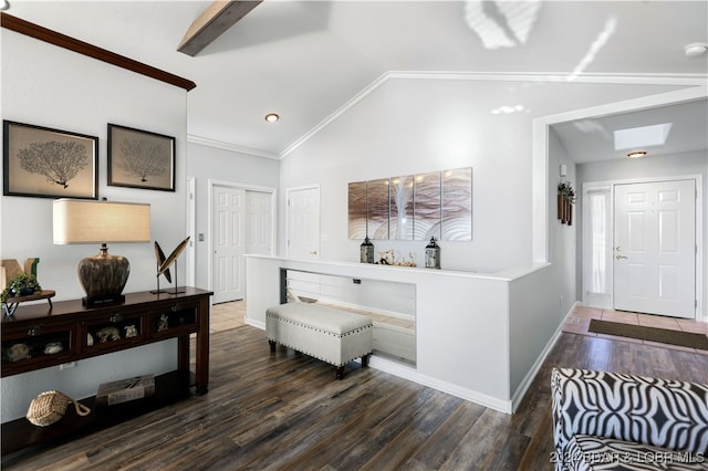 entryway with crown molding, lofted ceiling with skylight, and dark hardwood / wood-style flooring