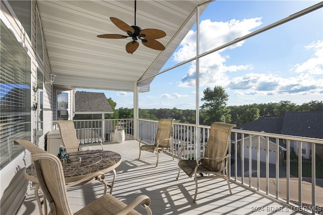 balcony with lofted ceiling and ceiling fan