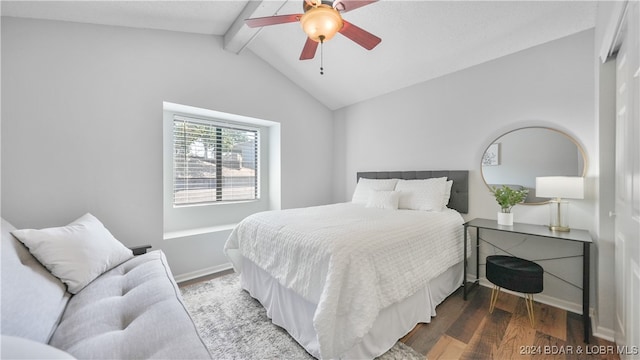 bedroom with wood-type flooring, a closet, lofted ceiling with beams, and ceiling fan