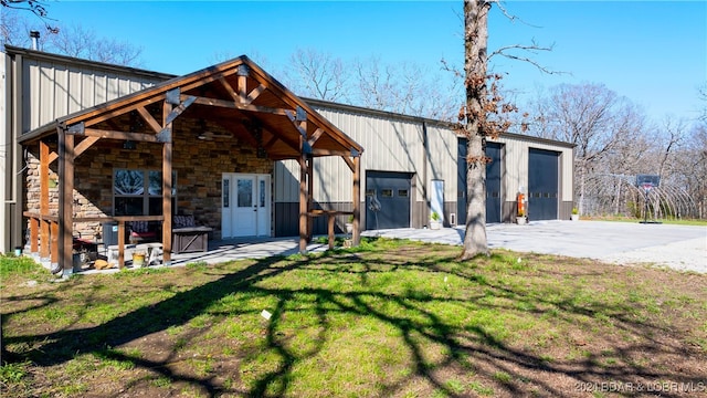 exterior space featuring a lawn and a garage