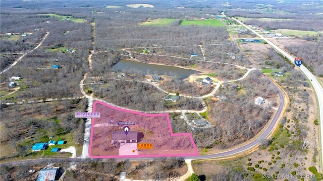 birds eye view of property featuring a water view