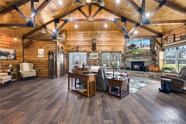 1251 Carnahan Rd, Macks Creek, MO 65786 - living room featuring high vaulted ceiling, wooden ceiling with exposed beams, wood finished floors, and a stone fireplace