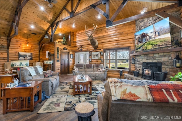 living room featuring wood ceiling, a wood stove, hardwood / wood-style floors, high vaulted ceiling, and beamed ceiling