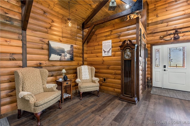 living area with log walls, dark hardwood / wood-style floors, and beam ceiling