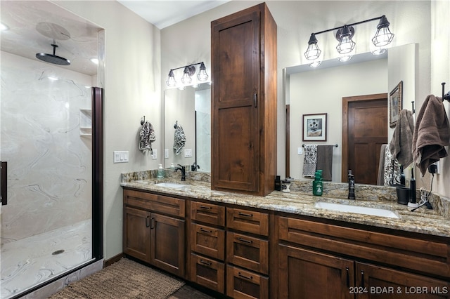 bathroom featuring walk in shower and vanity