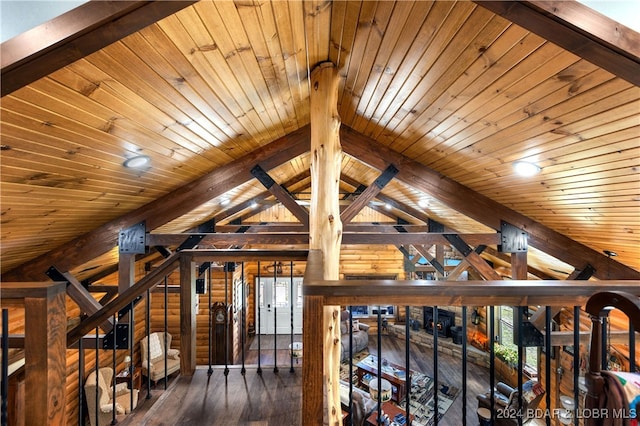 interior space with dark wood-type flooring, wood ceiling, and lofted ceiling with beams