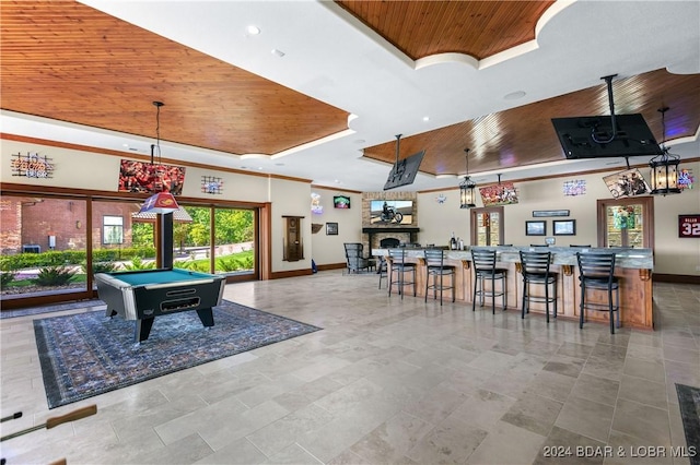 game room featuring pool table, indoor bar, a towering ceiling, a raised ceiling, and wood ceiling