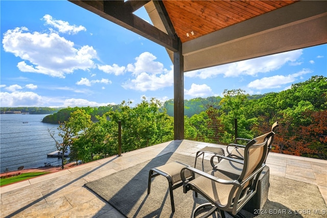 view of patio with a water view