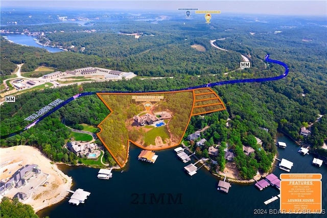 25 Springridge Ln, Villages, MO 65079 - aerial view of property and surrounding area with a heavily wooded area, a nearby body of water, and property boundaries highlighted