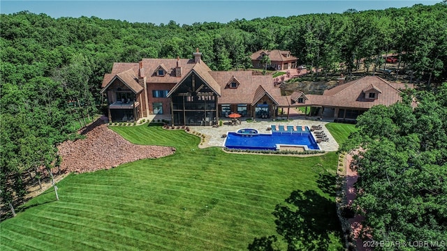 view of pool featuring a yard