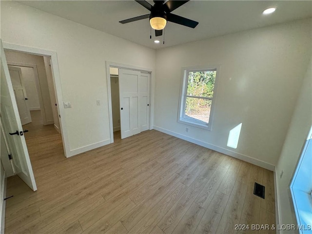 unfurnished bedroom with light wood-style flooring, visible vents, baseboards, and recessed lighting