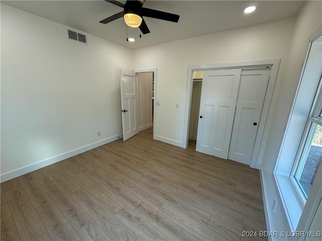 unfurnished bedroom featuring light wood finished floors, recessed lighting, visible vents, and baseboards