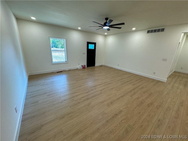 unfurnished room with ceiling fan, light wood finished floors, visible vents, and recessed lighting