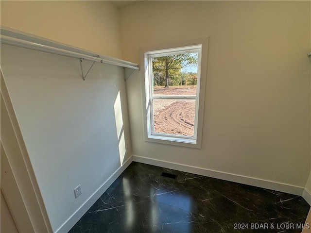 walk in closet with visible vents