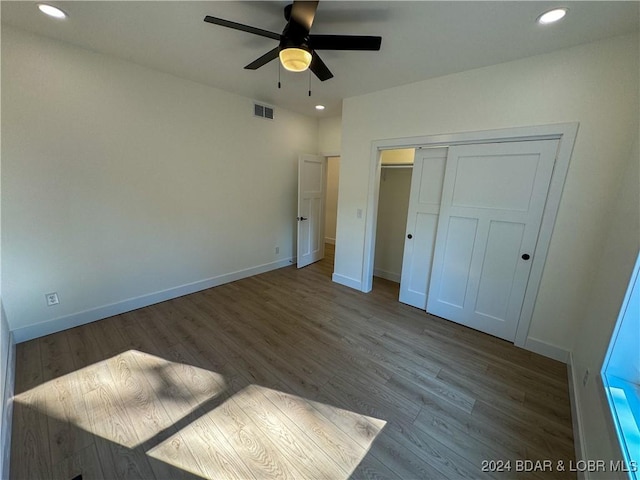 unfurnished bedroom featuring recessed lighting, visible vents, baseboards, and wood finished floors